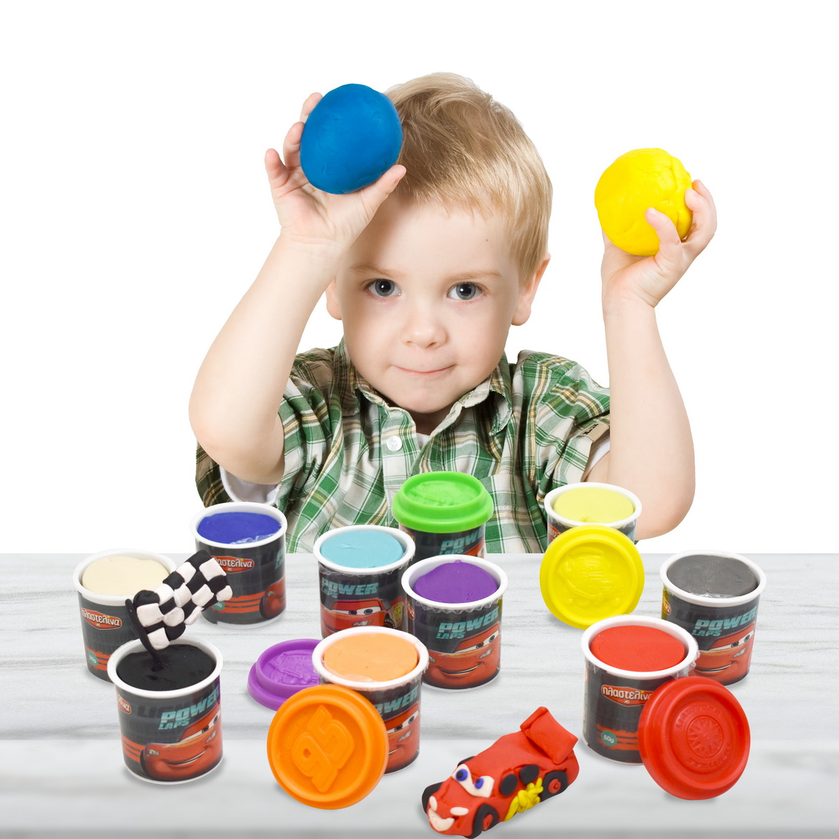 Child playing Color Plasticine, Kid molding multicolor Clay Toys Balls, white isolated