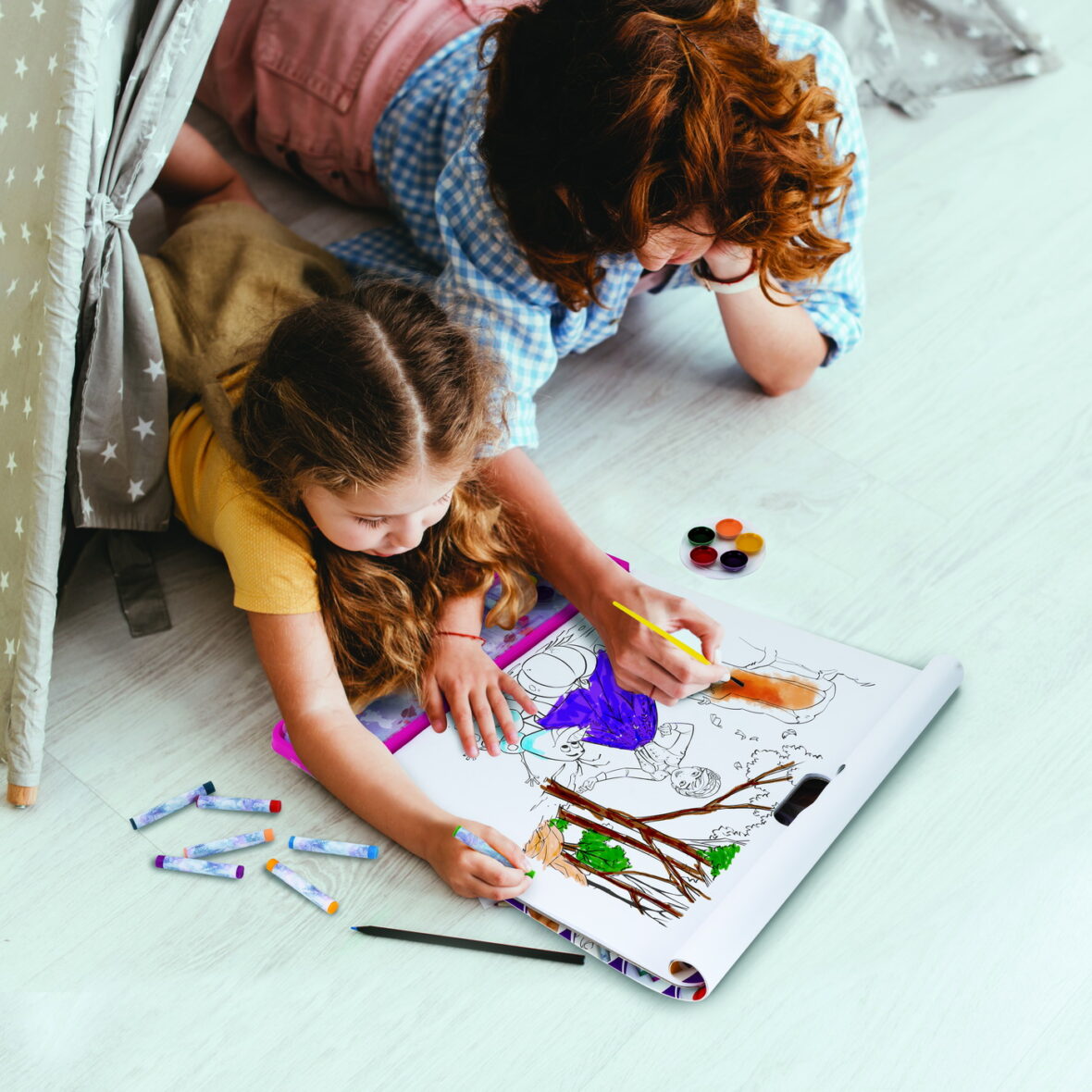 high angle view of nanny and child drawing while lying in toy wi