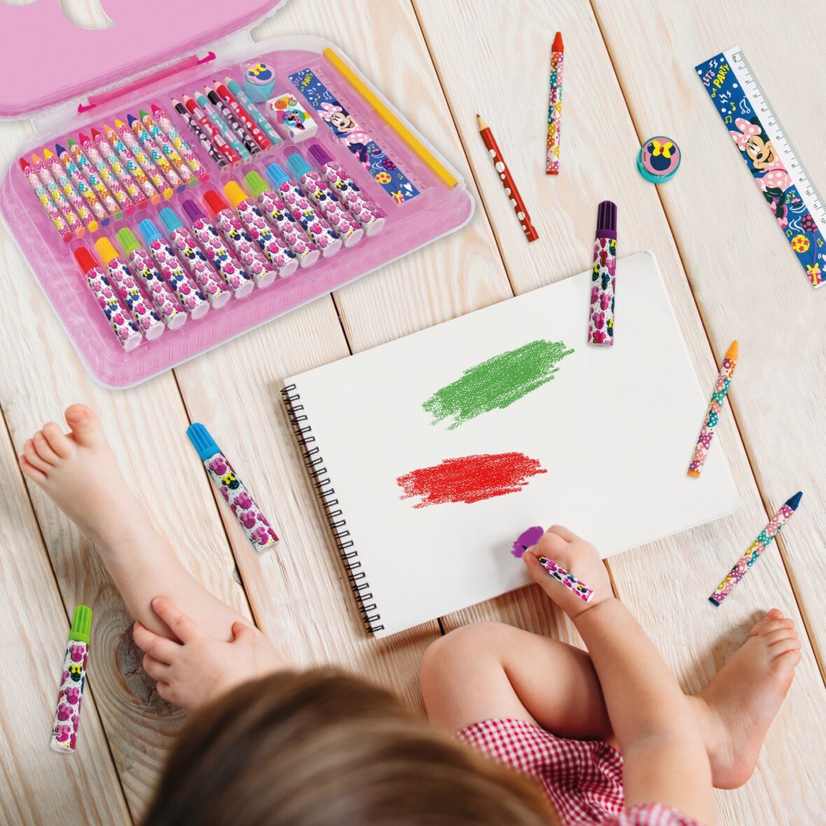 little girl drawing colorful pencils