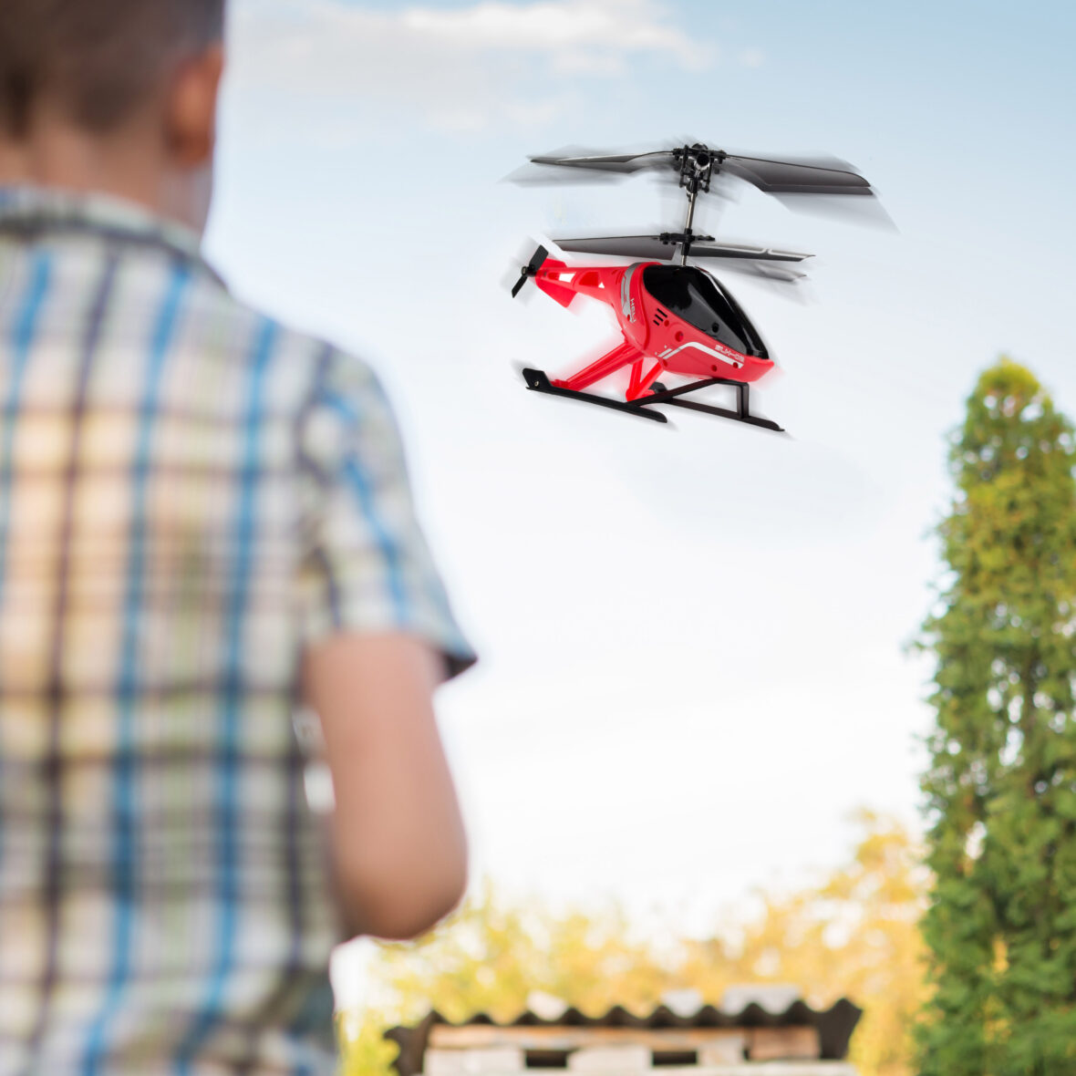 Kid flying drone. Boy operate drones