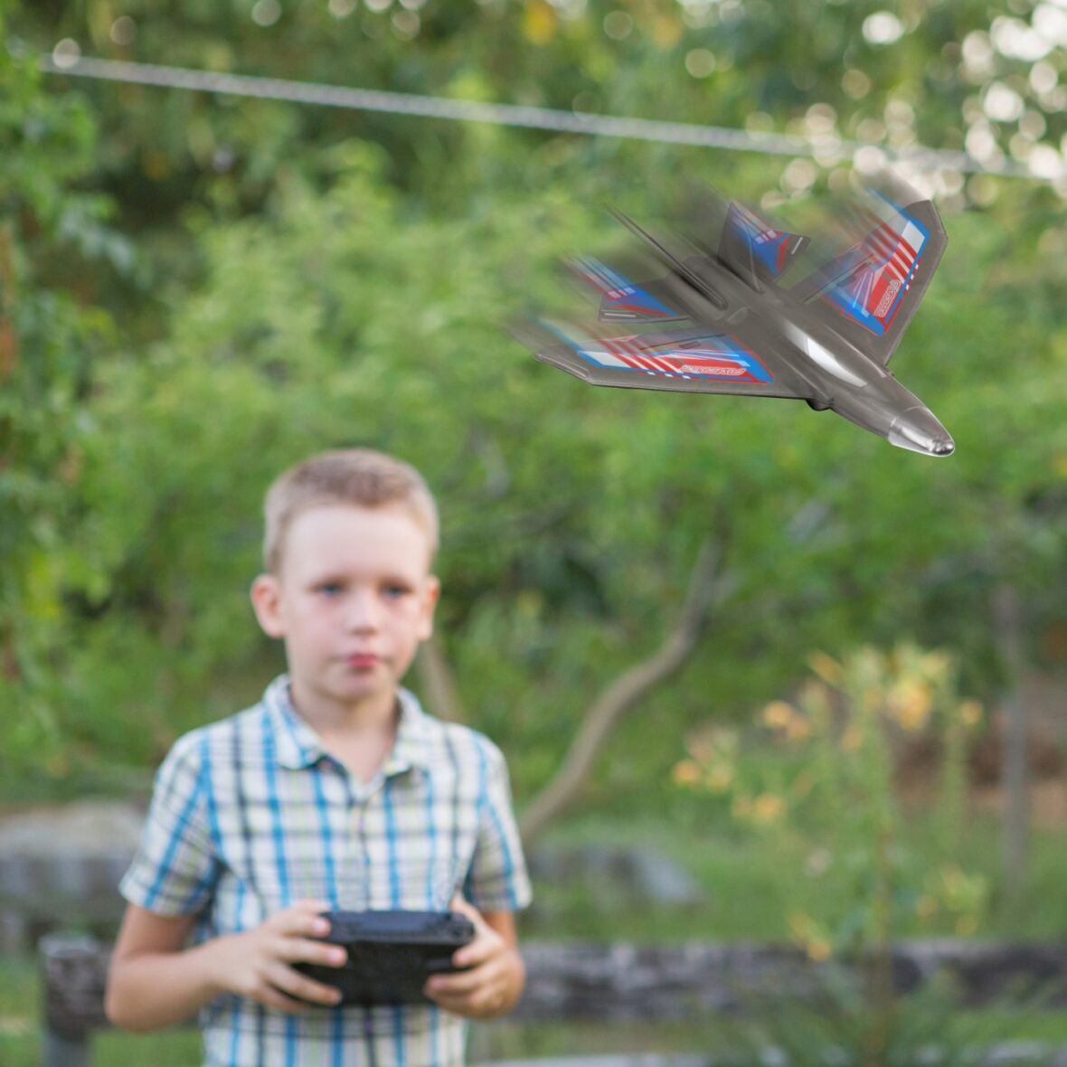 Kid flying drone. Boy operate drones
