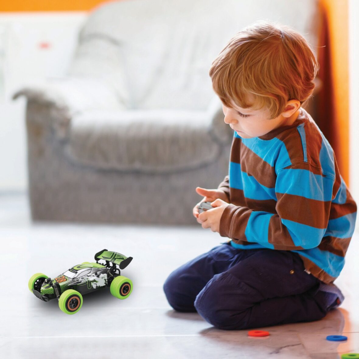 Little,Blond,Boy,Playing,With,Robot,Toy,At,Home,,Indoor
